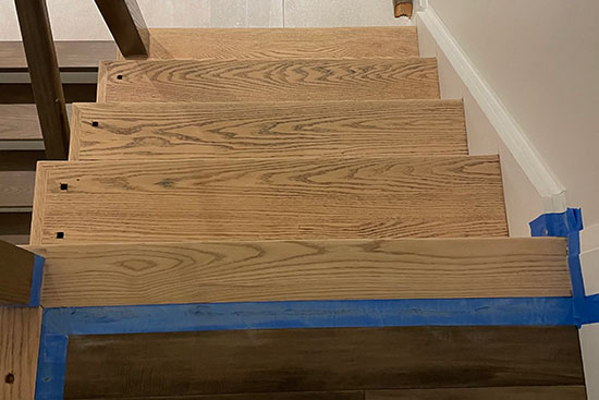 Hardwood stairs refinishing in a home renovation